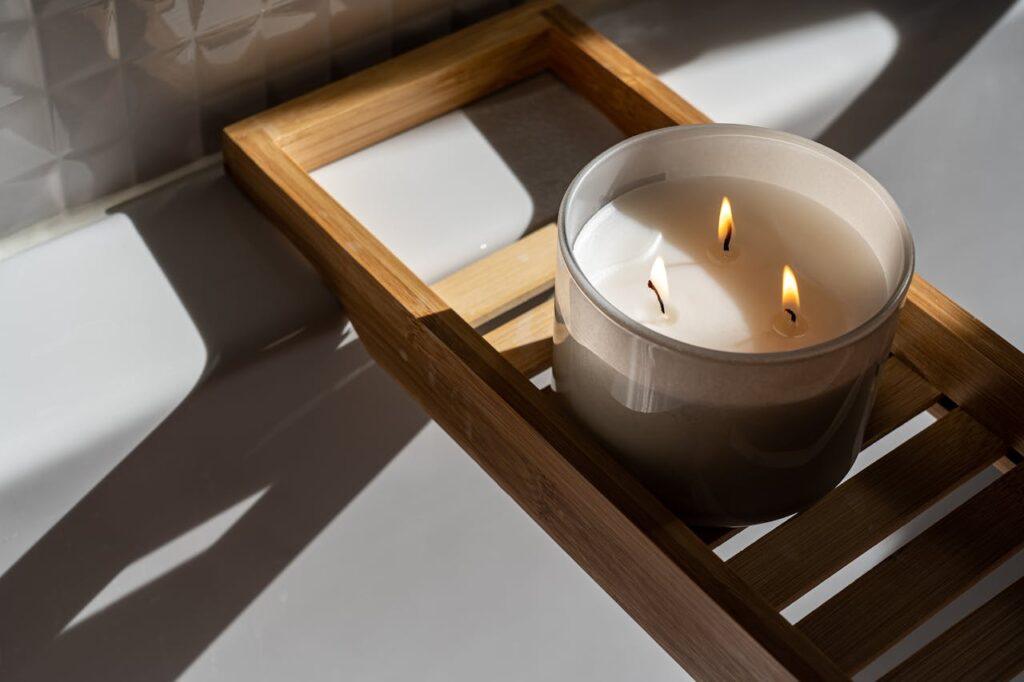 Crafting Captivating Headlines: Your awesome post title goes here A minimalist setting with a lit candle on a wooden tray, casting warm shadows and creating a soothing ambiance.